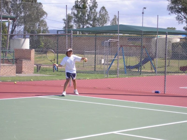 a man preparing to serve the tennis ball