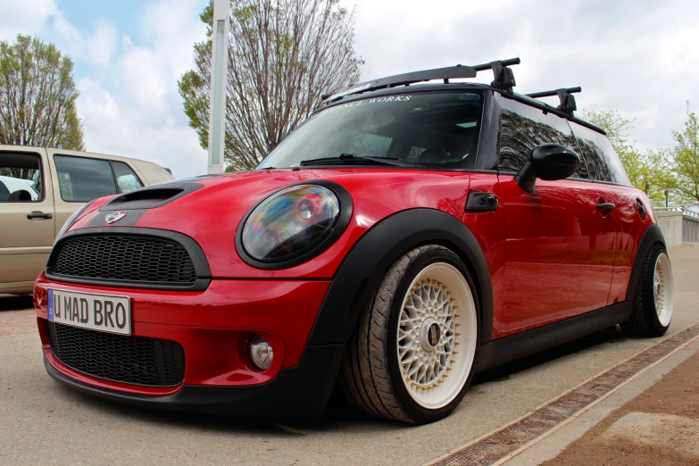 a red car parked in front of other cars