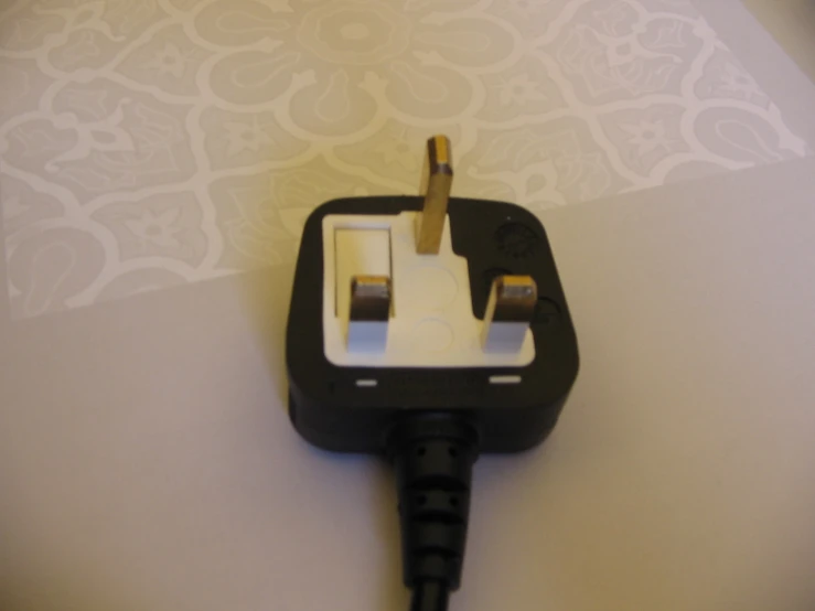 the black electrical plug has one side missing