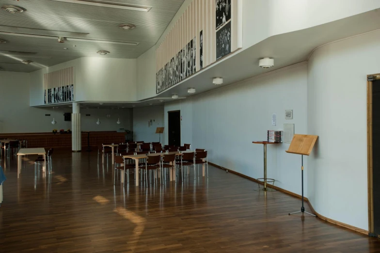 the interior of a building with a wooden floor