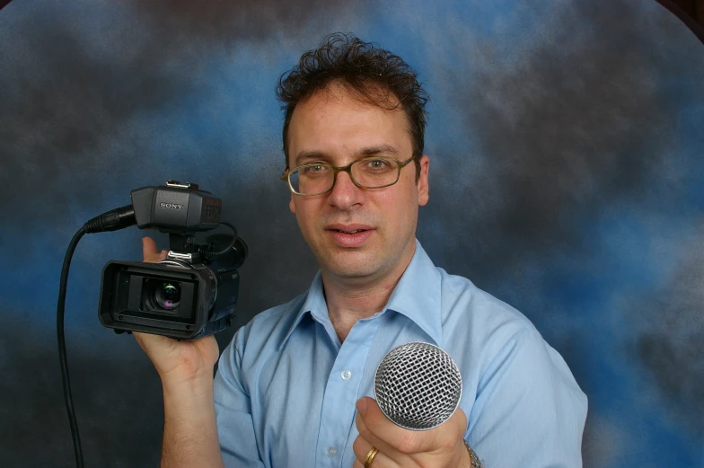a person holding a microphone and a microphone mic