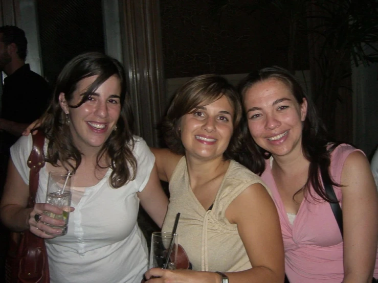 three women posing for a po together