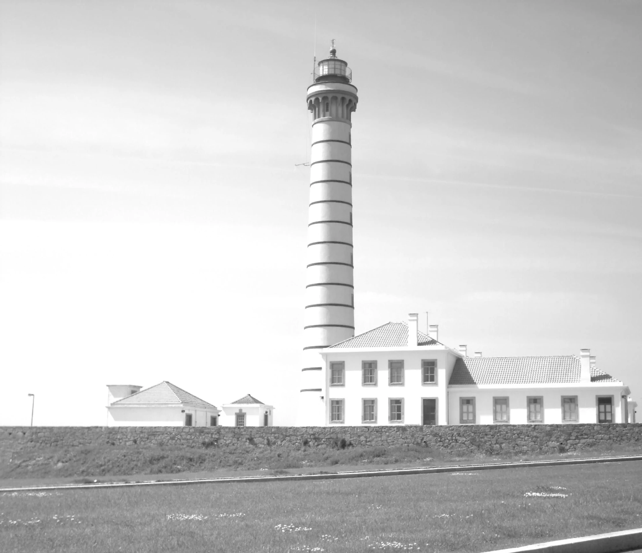 a black and white po of a lighthouse