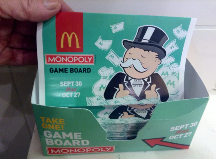 a green box contains an image of a monopoly game board