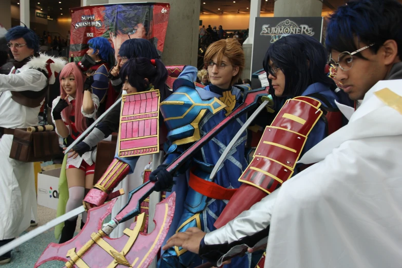 several anime cosplay are standing around wearing costumes