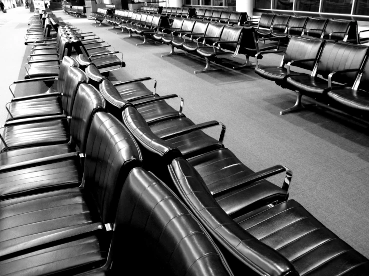 this is an image of rows of chairs in the airport