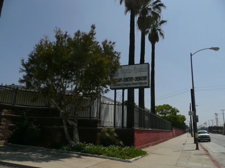 a street sign with a light pole in the background