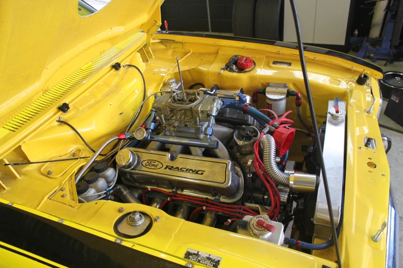 a yellow sports car engine compartment