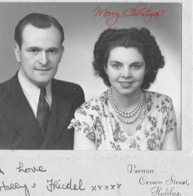 the woman and man are posing for a christmas card