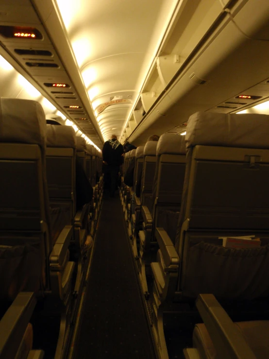 the empty passenger jet aisle of an airplane