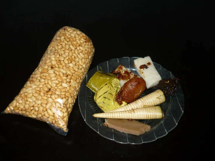 a plate with food on it next to a bag