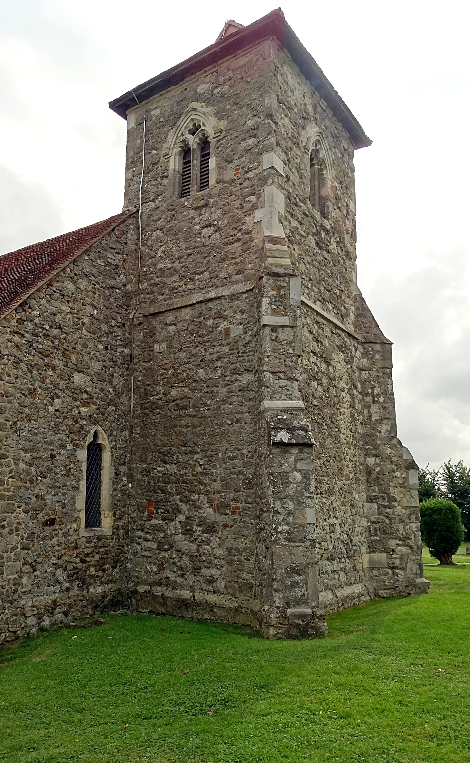 an old brick building with a tall clock on the tower