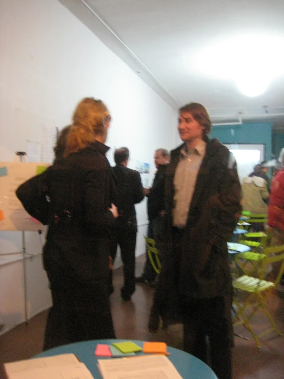 a man and woman having a conversation in an office