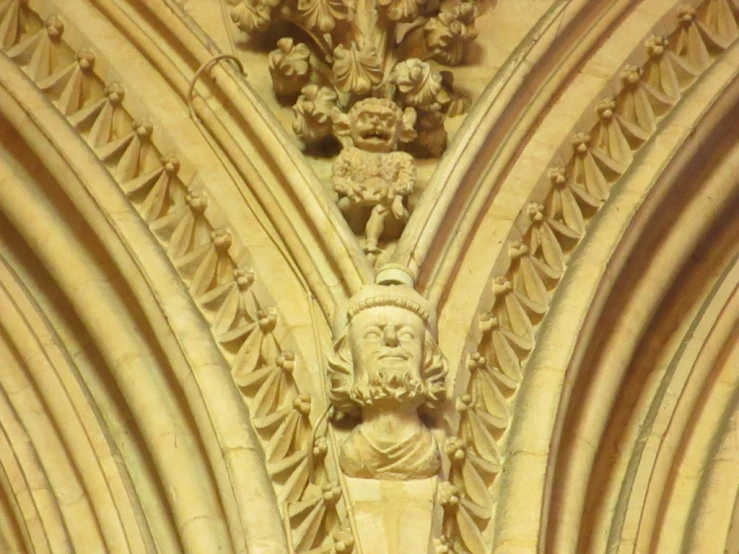 a stone carving is shown in front of a window