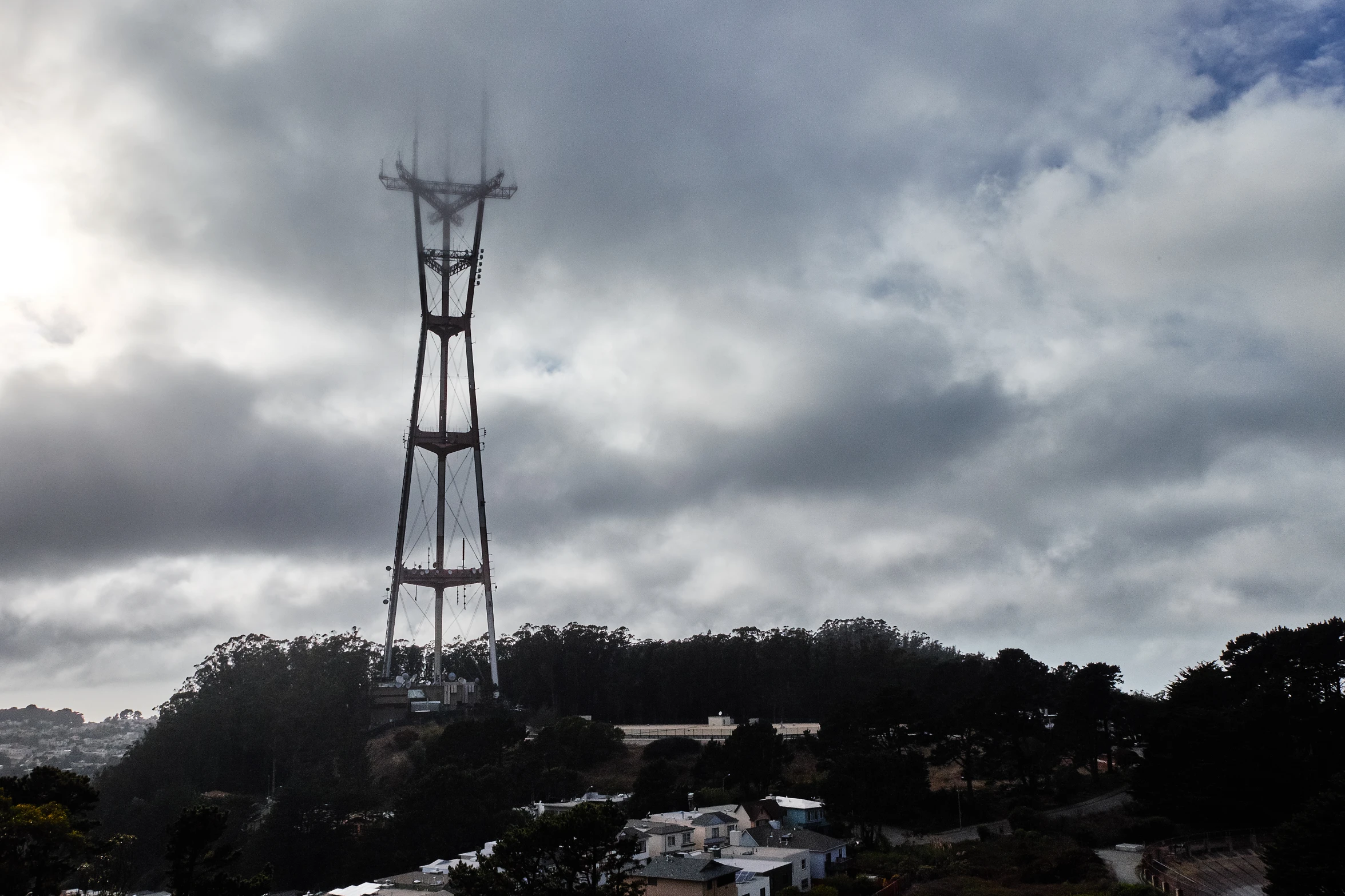 the tower is standing tall and is in front of clouds