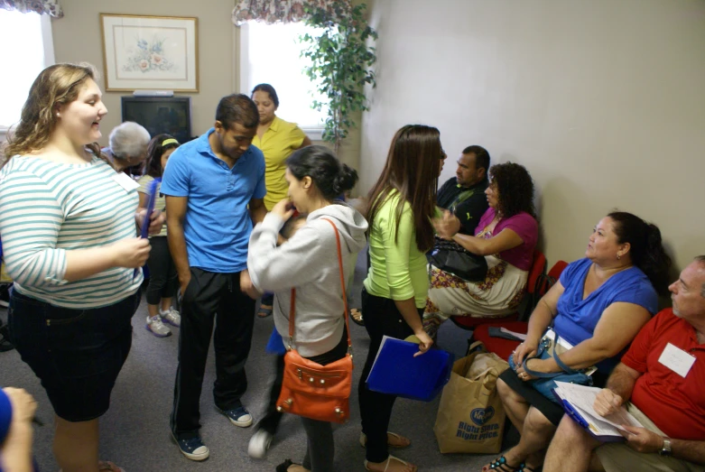 a group of people standing in a waiting room