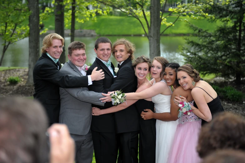 a group of people with arms around each other