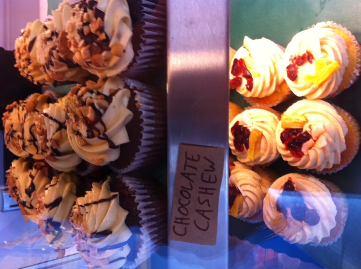 a display case filled with lots of different desserts