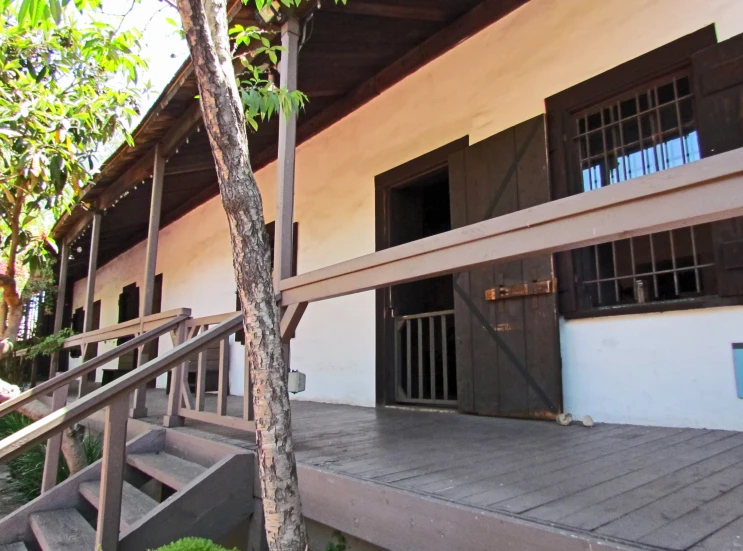 the front of a building with wooden stairs