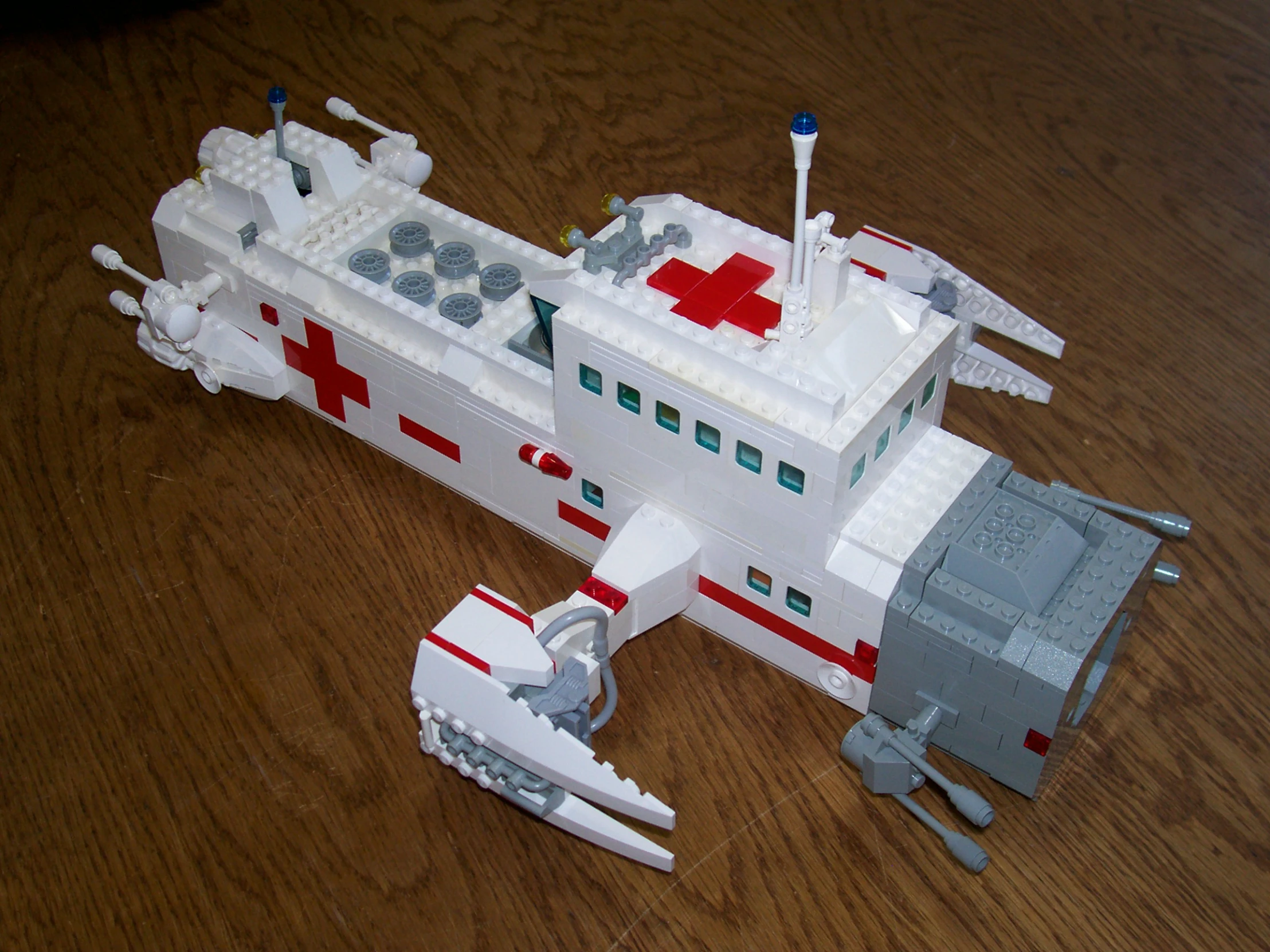 a small model of an ambulance boat on a table