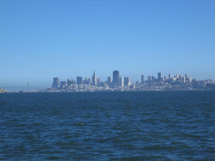 a view of the city across water from a ferry