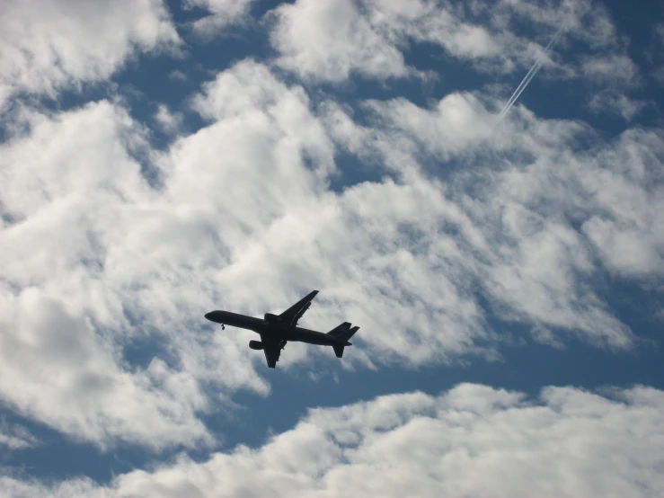 a passenger plane is flying through the clouds