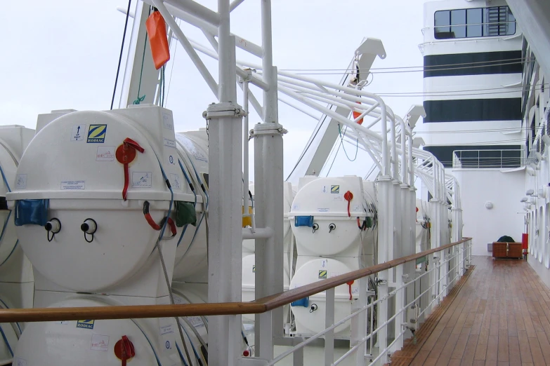 several buoys attached to a boat and one with a ladder