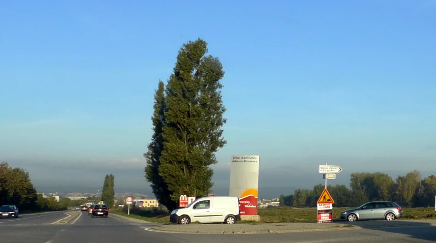 traffic traveling through a highway intersection with buildings