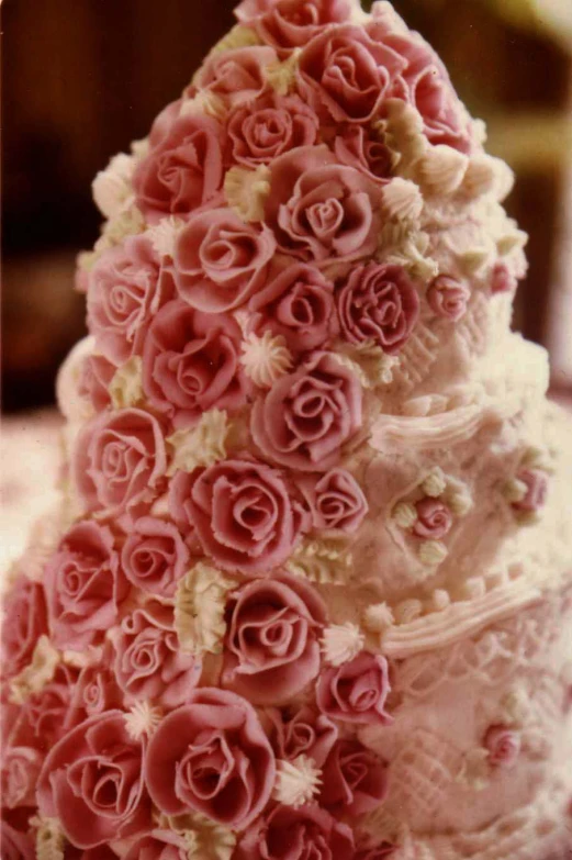 a close up of a very ornately decorated wedding cake