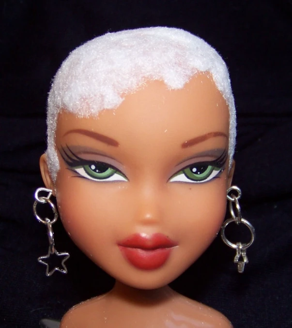 a doll has green eyes and pink lips