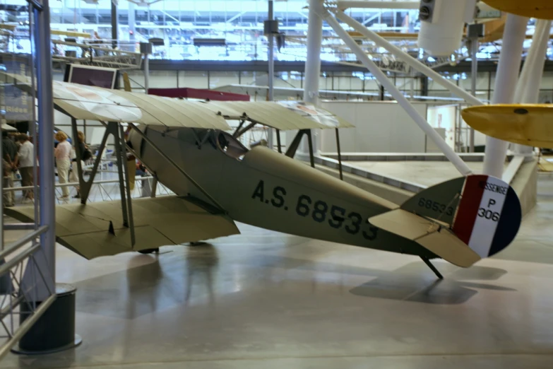 an old world war i airplane sits in a museum