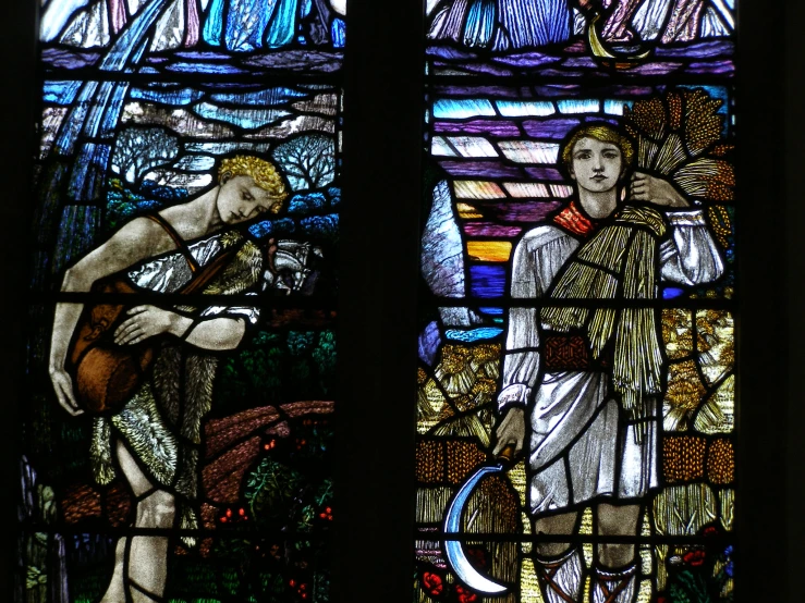 a stained glass window depicting the creation of a man