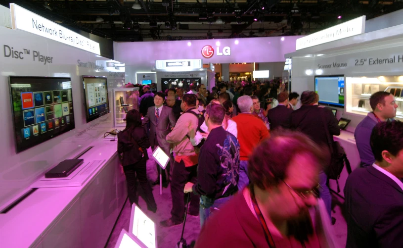 a crowd of people at a electronics store