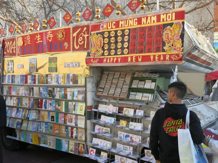 there is a chinese food vendor next to his stall