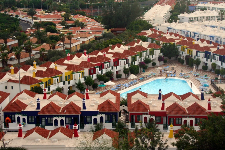 a group of buildings next to a swimming pool