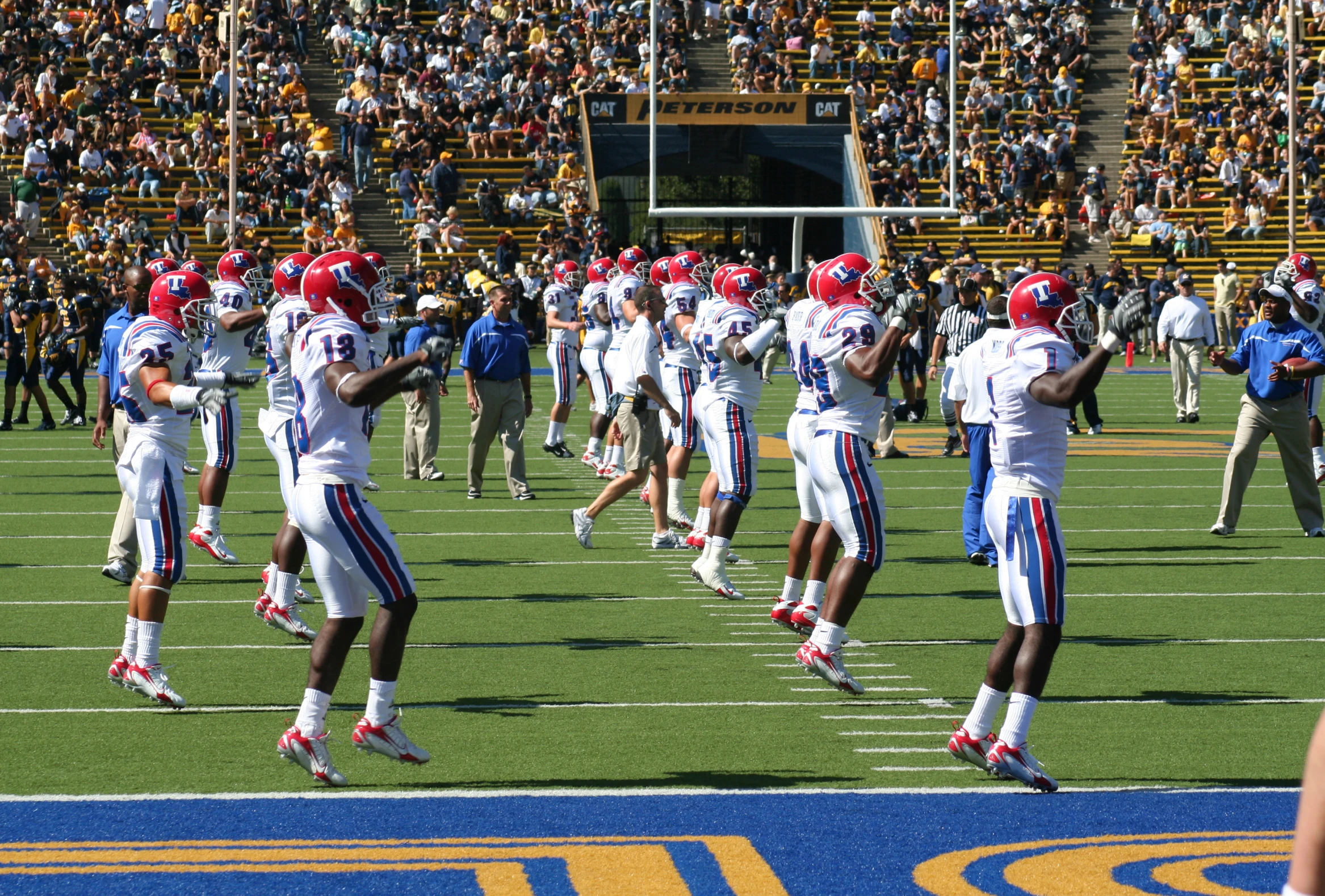 several american football players perform a hakaho dance