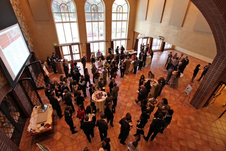 an aerial view of people at a function hall