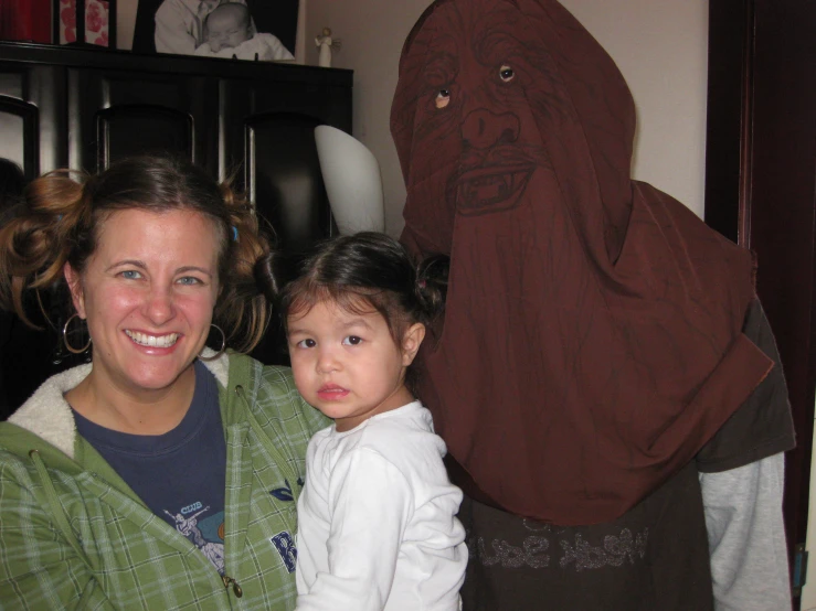 a woman with a child standing next to a statue of jesus