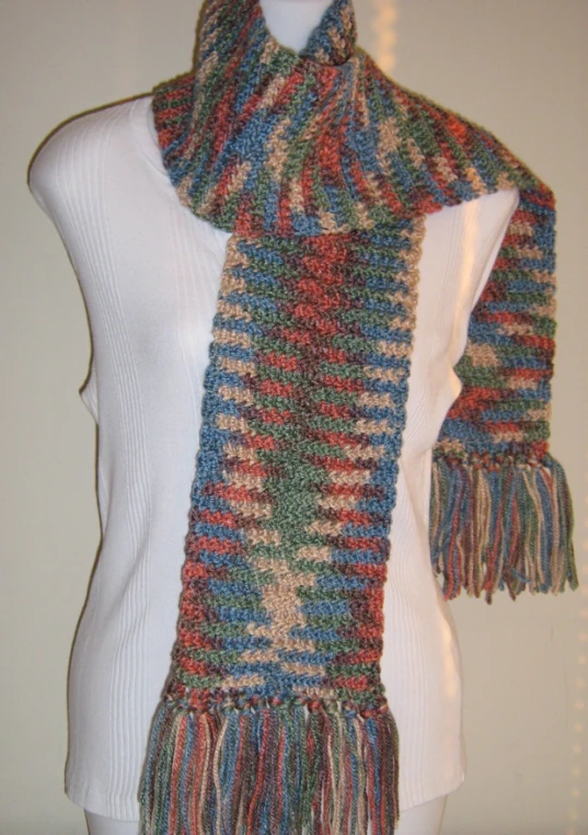 a woman wearing a multicolored knit scarf