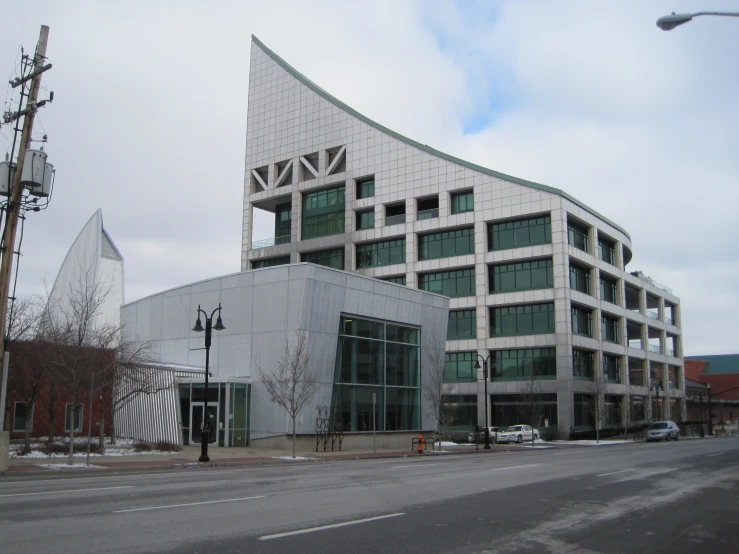 a building with large curved windows in a city