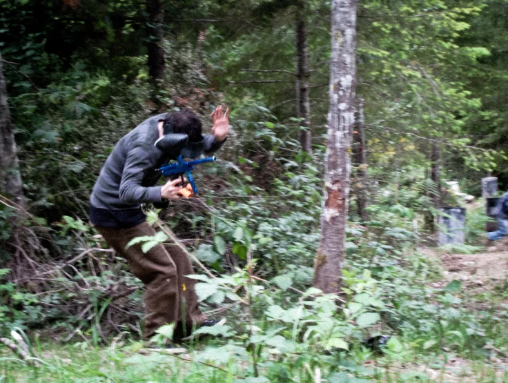 a man is in the woods catching up on his bird