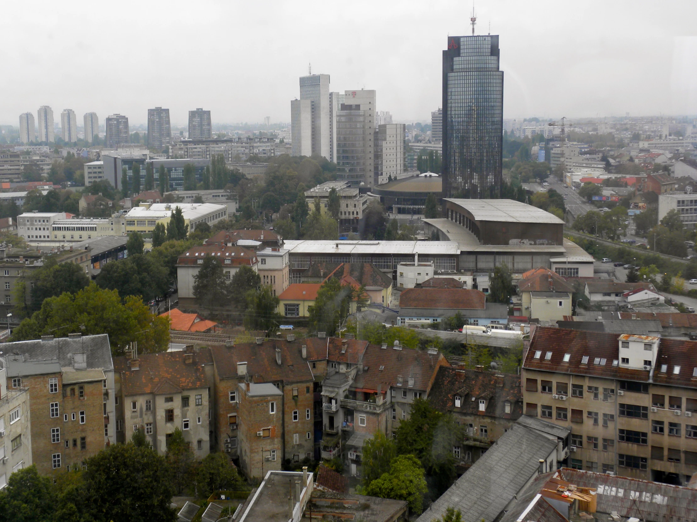 the cityscape is very overcast, with high rise buildings and tall skyscrs