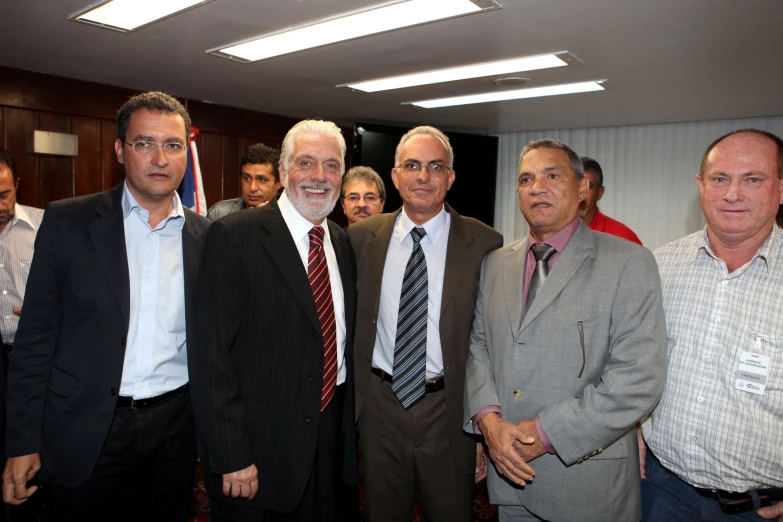 the men are posing together for a picture