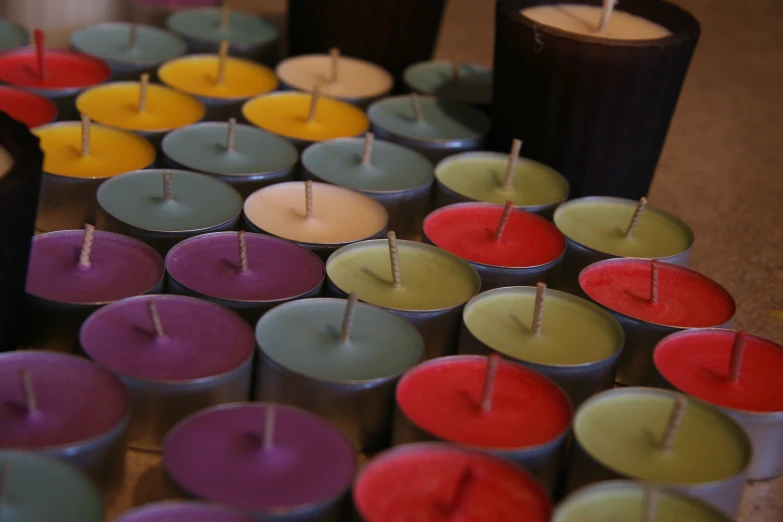 candles arranged in the shape of heart on wooden table