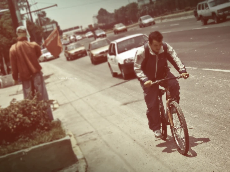 a person riding a bicycle down a city street