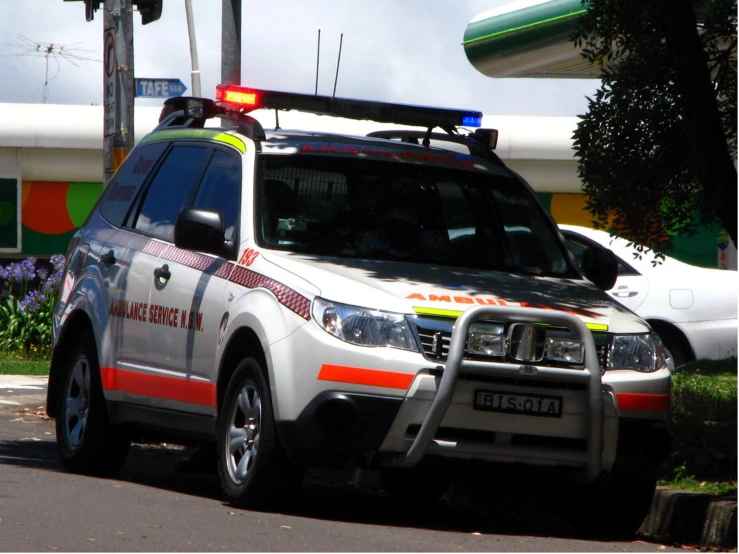 a police car sits parked at the curb