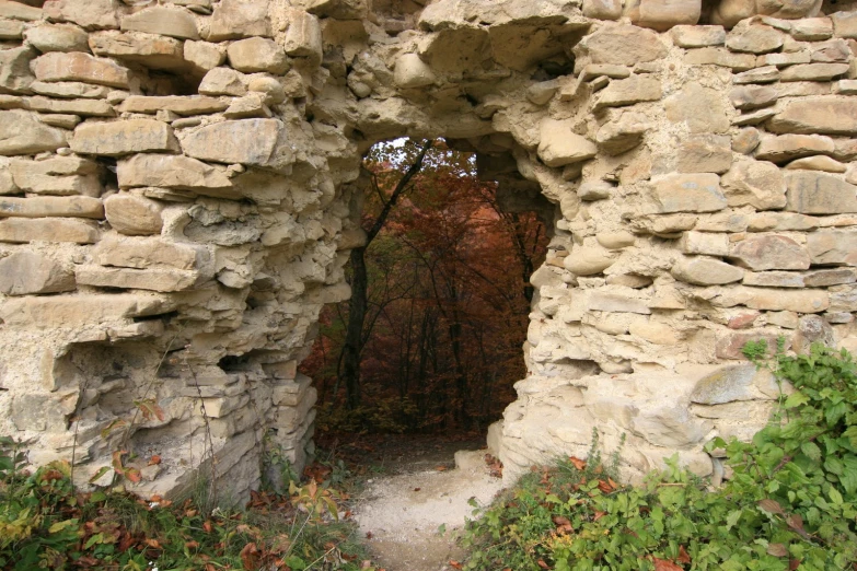the door to an old stone walled building
