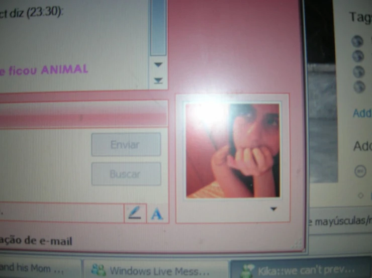 a computer screen with an image of a woman holding a cell phone