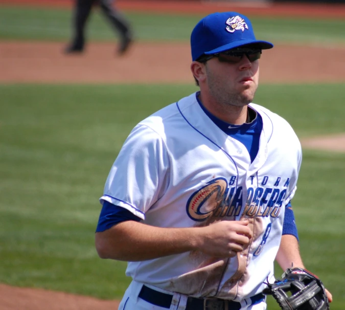 a baseball player is on the field with his glove