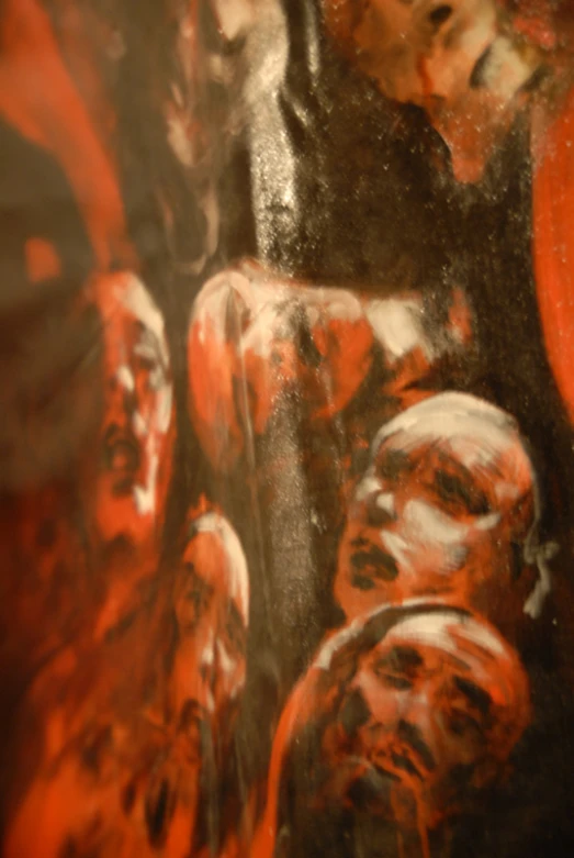 a closeup of a large red and black painting